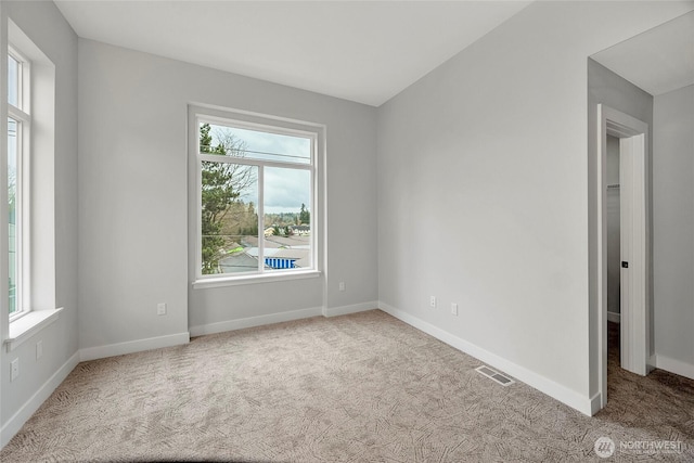 6726 NE 187th St Unit 104, Kenmore, WA 98028 - carpeted spare room with baseboards