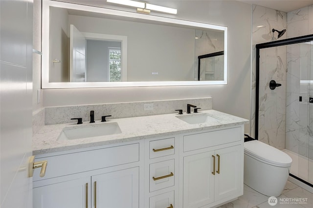 6726 NE 187th St Unit 104, Kenmore, WA 98028 - full bath with marble look tile flooring, a marble finish shower, double vanity, and toilet
