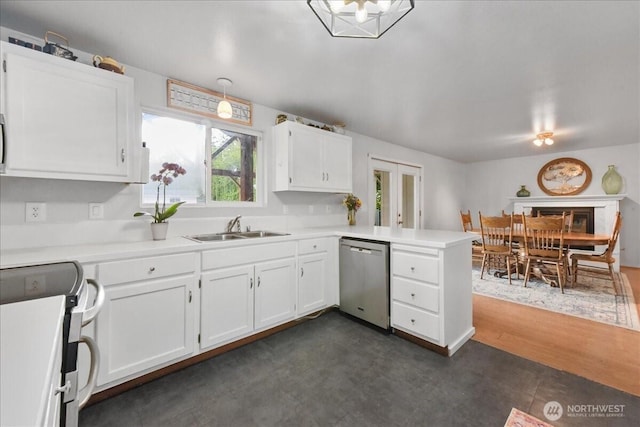 32509 80th Dr NW, Stanwood, WA 98292 - kitchen with dishwasher, electric stove, a sink, a peninsula, and white cabinets