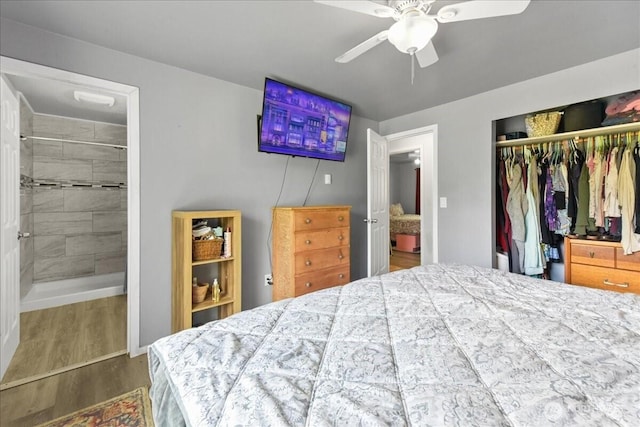 32509 80th Dr NW, Stanwood, WA 98292 - bedroom featuring a closet, wood finished floors, ensuite bathroom, and a ceiling fan