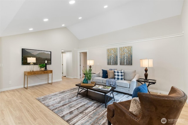20103 75th Ave NE, Kenmore, WA 98028 - living room featuring wood finished floors, baseboards, recessed lighting, and high vaulted ceiling