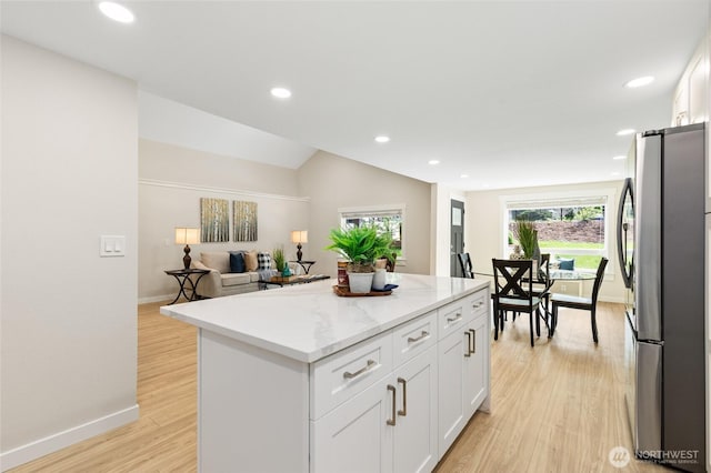 20103 75th Ave NE, Kenmore, WA 98028 - kitchen featuring freestanding refrigerator, a center island, baseboards, white cabinetry, and recessed lighting