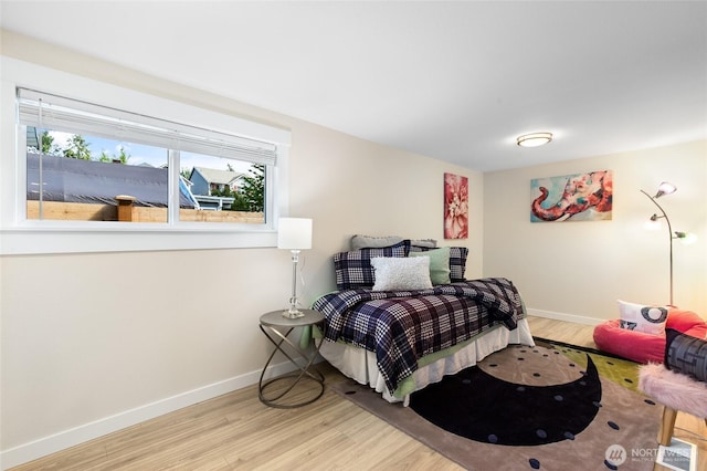 20103 75th Ave NE, Kenmore, WA 98028 - bedroom featuring wood finished floors and baseboards