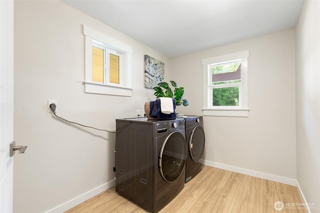 20103 75th Ave NE, Kenmore, WA 98028 - laundry room featuring separate washer and dryer, baseboards, and light wood-type flooring