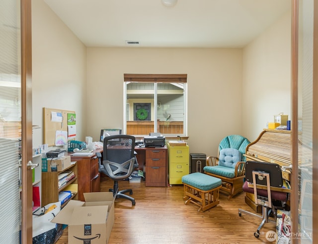 home office with wood finished floors