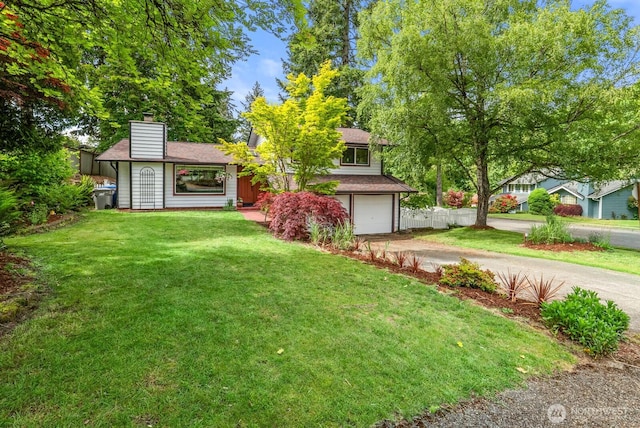1933 Dayton Dr SE, Renton, WA 98055 - view of green lawn featuring dirt driveway and an attached garage