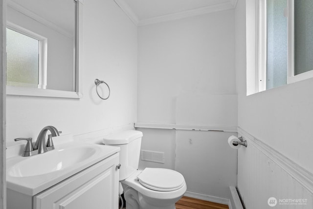 1933 Dayton Dr SE, Renton, WA 98055 - bathroom featuring toilet, crown molding, vanity, and wood finished floors