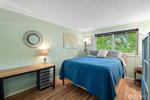 1933 Dayton Dr SE, Renton, WA 98055 - bedroom with a textured ceiling, wood finished floors, baseboards, and crown molding