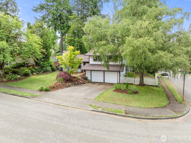 1933 Dayton Dr SE, Renton, WA 98055 - view of property hidden behind natural elements with an attached garage and driveway