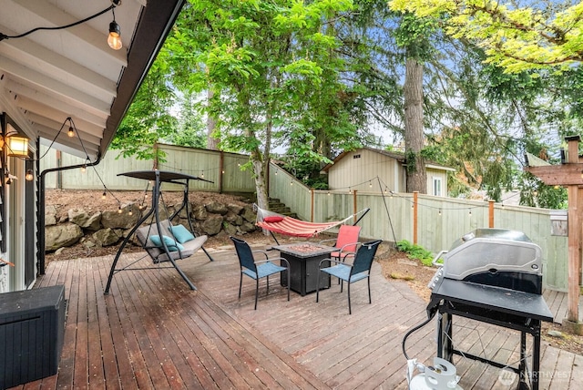 1933 Dayton Dr SE, Renton, WA 98055 - deck featuring an outdoor fire pit, a fenced backyard, and area for grilling