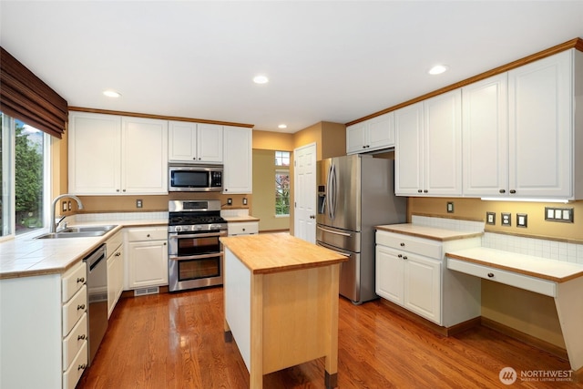 1521 55th Ct SE, Auburn, WA 98092 - kitchen with appliances with stainless steel finishes, a sink, plenty of natural light, butcher block countertops, and recessed lighting