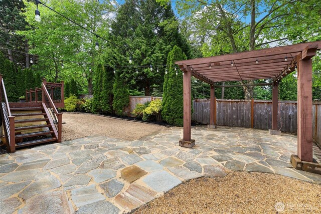 1521 55th Ct SE, Auburn, WA 98092 - fenced backyard with a patio area, a pergola, stairs, and a deck