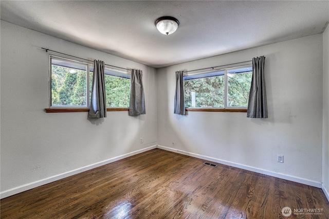 1245 SW 301st St, Federal Way, WA 98023 - unfurnished room with dark wood-style floors and baseboards