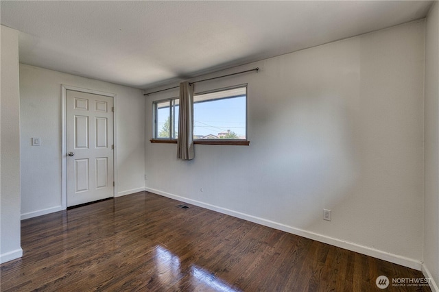 1245 SW 301st St, Federal Way, WA 98023 - unfurnished bedroom featuring baseboards and dark wood finished floors