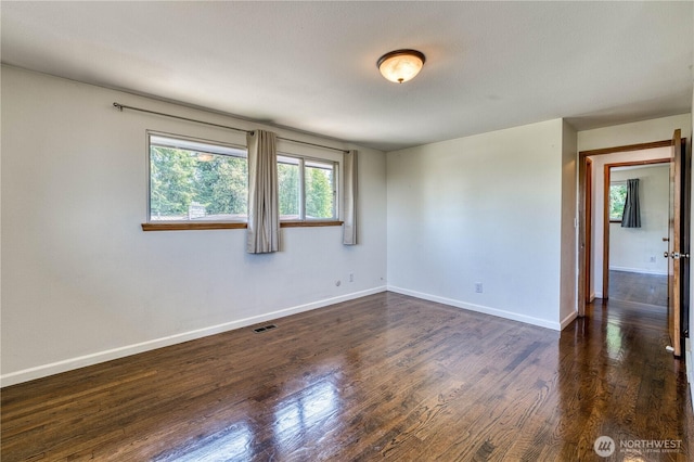 1245 SW 301st St, Federal Way, WA 98023 - unfurnished room featuring dark wood-type flooring and baseboards