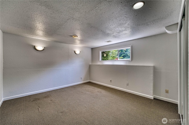 1245 SW 301st St, Federal Way, WA 98023 - carpeted spare room featuring a textured ceiling, a textured wall, and baseboards