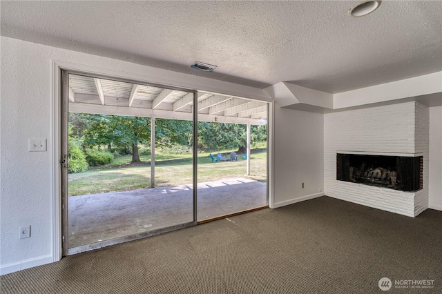 1245 SW 301st St, Federal Way, WA 98023 - unfurnished living room featuring carpet, baseboards, a textured ceiling, plenty of natural light, and a textured wall