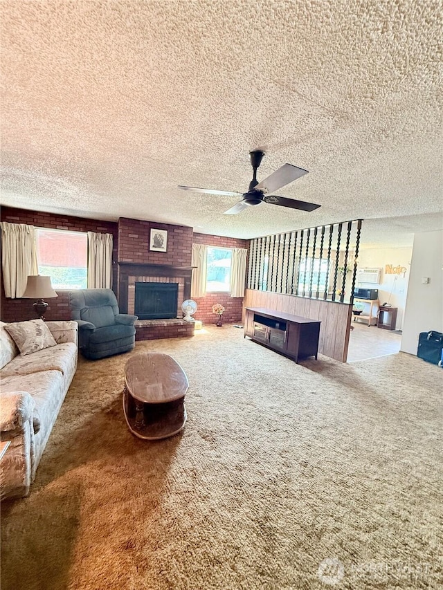 718 Ridge Pl, Omak, WA 98841 - living room featuring a fireplace, carpet, a textured ceiling, and a ceiling fan