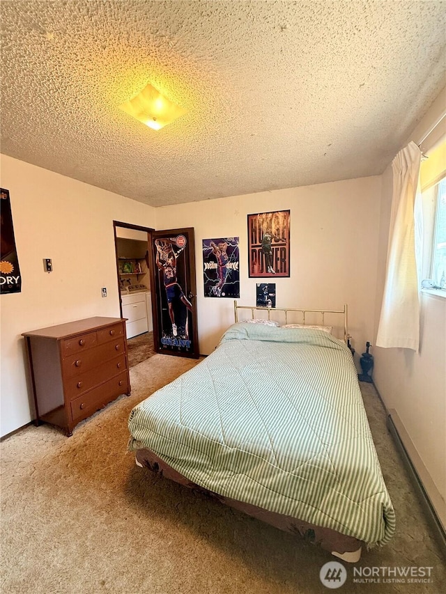 718 Ridge Pl, Omak, WA 98841 - carpeted bedroom with a textured ceiling and washer / clothes dryer