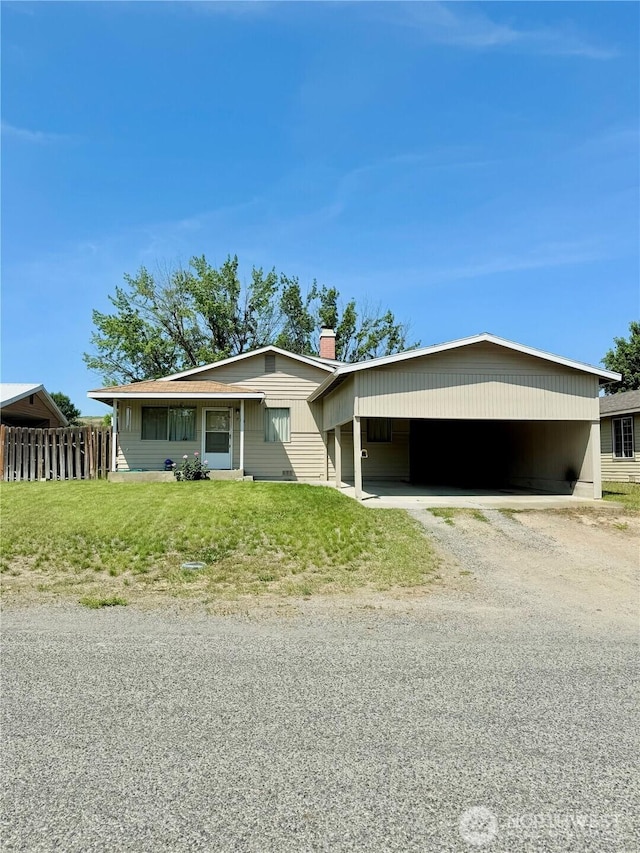 718 Ridge Pl, Omak, WA 98841 - view of front facade featuring driveway, a chimney, and an attached carport