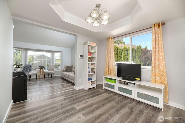1416 116th Dr SE, Lake Stevens, WA 98258 - sitting room featuring ornamental molding, a chandelier, wood finished floors, a tray ceiling, and baseboards