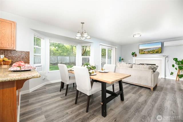 1416 116th Dr SE, Lake Stevens, WA 98258 - dining room with an AC wall unit, healthy amount of natural light, light wood-type flooring, and a chandelier