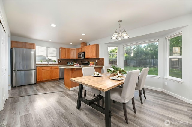 1416 116th Dr SE, Lake Stevens, WA 98258 - dining area featuring a chandelier, light wood-style floors, recessed lighting, and baseboards