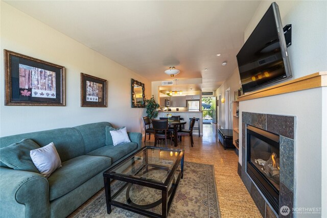 2220 W Woodin Ave Unit 210, Chelan, WA 98816 - living area featuring a tiled fireplace and recessed lighting
