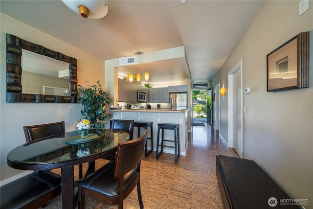 2220 W Woodin Ave Unit 210, Chelan, WA 98816 - dining space featuring baseboards