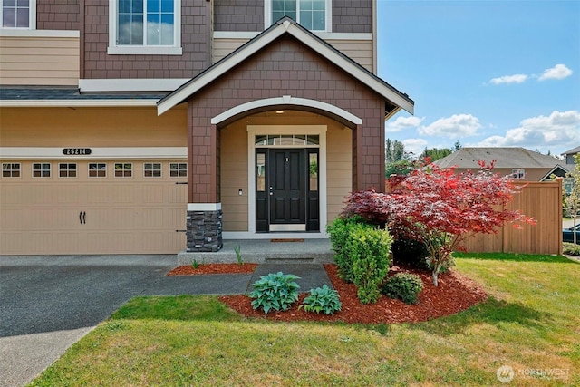 25214 113th Ave SE, Kent, WA 98030 - doorway to property featuring a garage, asphalt driveway, a lawn, and stone siding