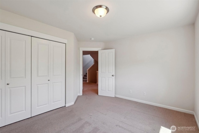 25214 113th Ave SE, Kent, WA 98030 - unfurnished bedroom featuring carpet, baseboards, and a closet