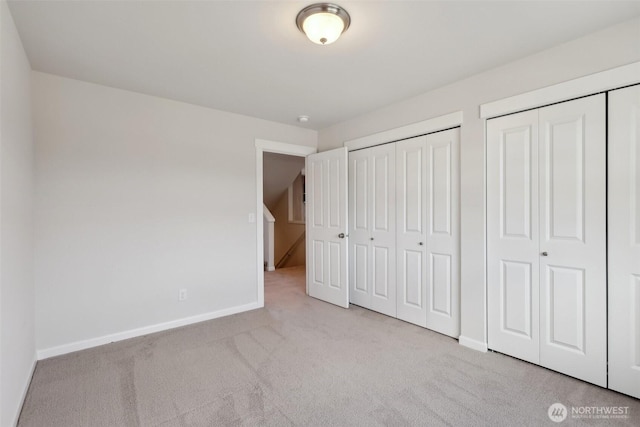 25214 113th Ave SE, Kent, WA 98030 - unfurnished bedroom with carpet flooring, two closets, and baseboards