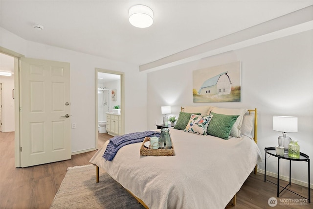 2201 192nd St SE Unit R105, Bothell, WA 98012 - bedroom with wood finished floors, connected bathroom, and baseboards