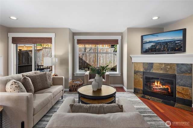 830 15th Ave Unit A, Seattle, WA 98122 - living room featuring wood finished floors, a fireplace, baseboards, and recessed lighting