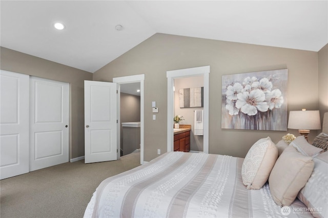830 15th Ave Unit A, Seattle, WA 98122 - bedroom featuring vaulted ceiling, light colored carpet, ensuite bath, a closet, and baseboards