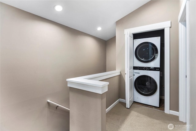 830 15th Ave Unit A, Seattle, WA 98122 - laundry room with stacked washing machine and dryer, light colored carpet, baseboards, and recessed lighting