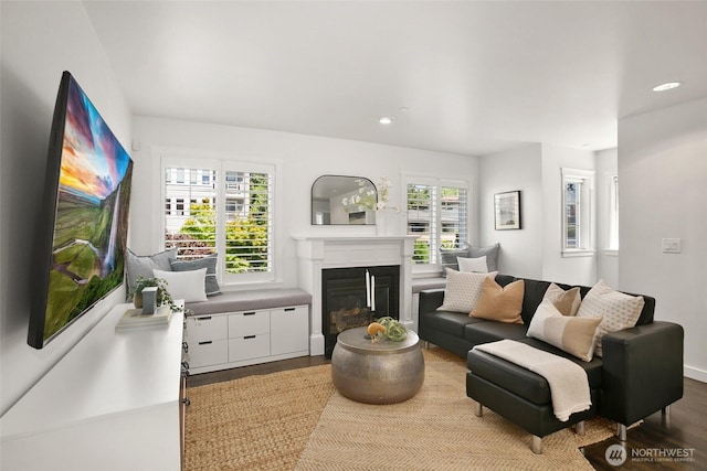 2643A NW 59th St, Seattle, WA 98107 - living room featuring wood finished floors, a glass covered fireplace, recessed lighting, and baseboards