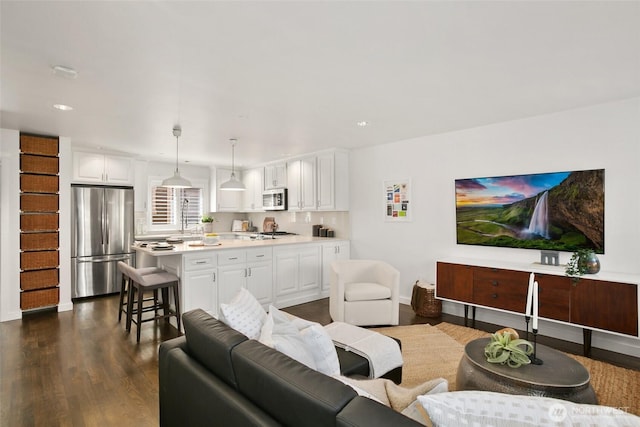2643A NW 59th St, Seattle, WA 98107 - living room with dark wood-style floors, recessed lighting, and baseboards