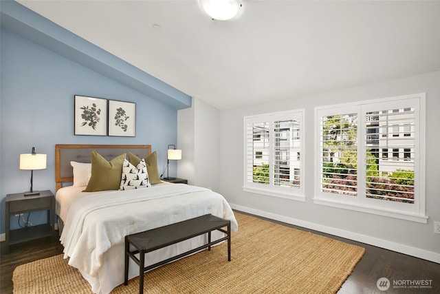 2643A NW 59th St, Seattle, WA 98107 - bedroom featuring lofted ceiling, baseboards, and wood finished floors