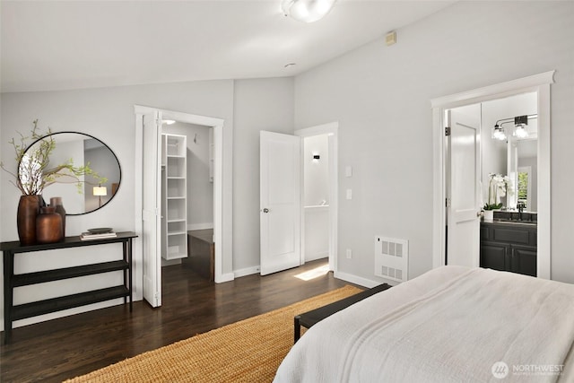 2643A NW 59th St, Seattle, WA 98107 - bedroom featuring lofted ceiling, wood finished floors, a walk in closet, baseboards, and ensuite bath