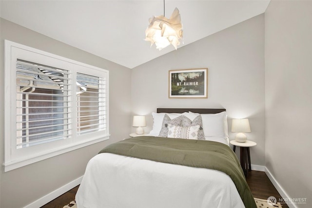 2643A NW 59th St, Seattle, WA 98107 - bedroom with baseboards, dark wood-style flooring, and vaulted ceiling