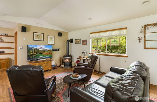 290 E Budd Dr, Shelton, WA 98584 - living area with a wood stove, vaulted ceiling, and wood finished floors