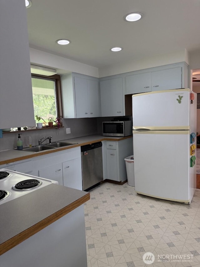 2 Quinault Way, La Conner, WA 98257 - kitchen featuring appliances with stainless steel finishes, a sink, light flooring, and recessed lighting