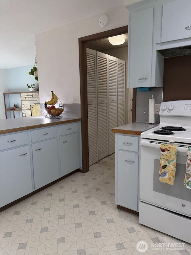 2 Quinault Way, La Conner, WA 98257 - kitchen featuring white range with electric cooktop, light floors, and light countertops
