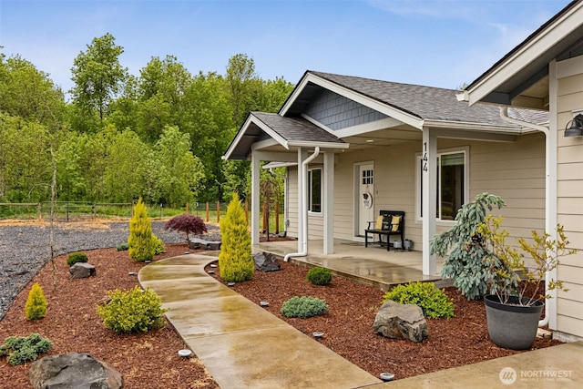 144 Faun Rae Ln, Chehalis, WA 98532 - view of exterior entry featuring a porch and a shingled roof