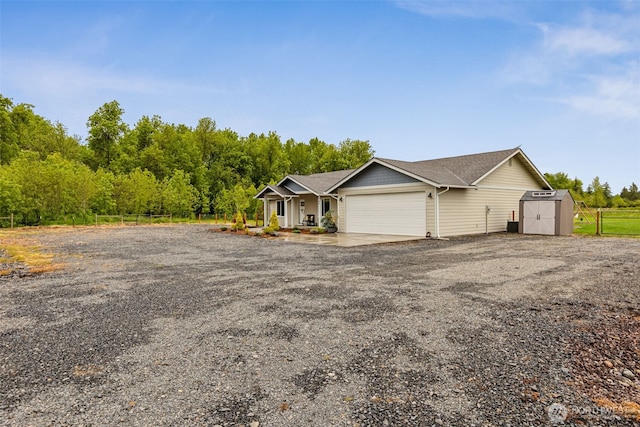 144 Faun Rae Ln, Chehalis, WA 98532 - view of front of house featuring a garage, covered porch, and roof with shingles