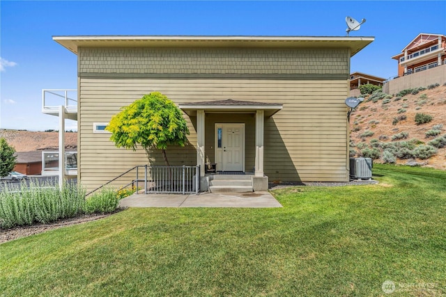 9159 Riverview Way NW Unit D39, Quincy, WA 98848 - view of front of property with central air condition unit and a patio area
