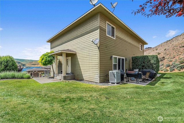 9159 Riverview Way NW Unit D39, Quincy, WA 98848 - rear view of house with a patio area, cooling unit, and a yard