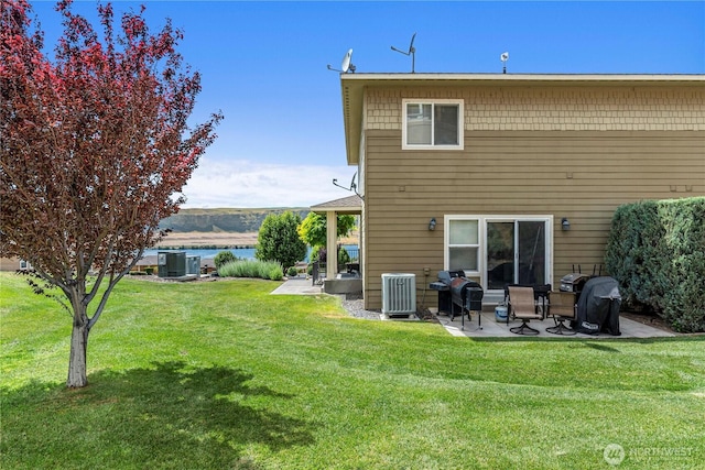 9159 Riverview Way NW Unit D39, Quincy, WA 98848 - rear view of house featuring a patio area, central AC unit, and a yard