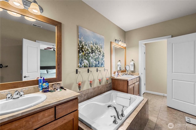 9159 Riverview Way NW Unit D39, Quincy, WA 98848 - bathroom featuring a bath, vanity, tile patterned flooring, and ceiling fan